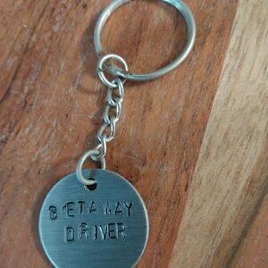 Chic Silver Keychain with 'Getaway Driver' Design